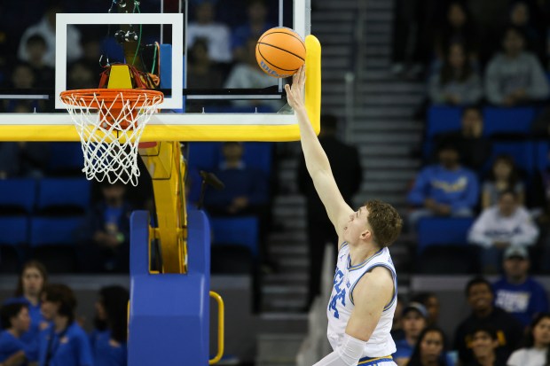 UCLA forward Tyler Bilodeau shoots during the first half of...