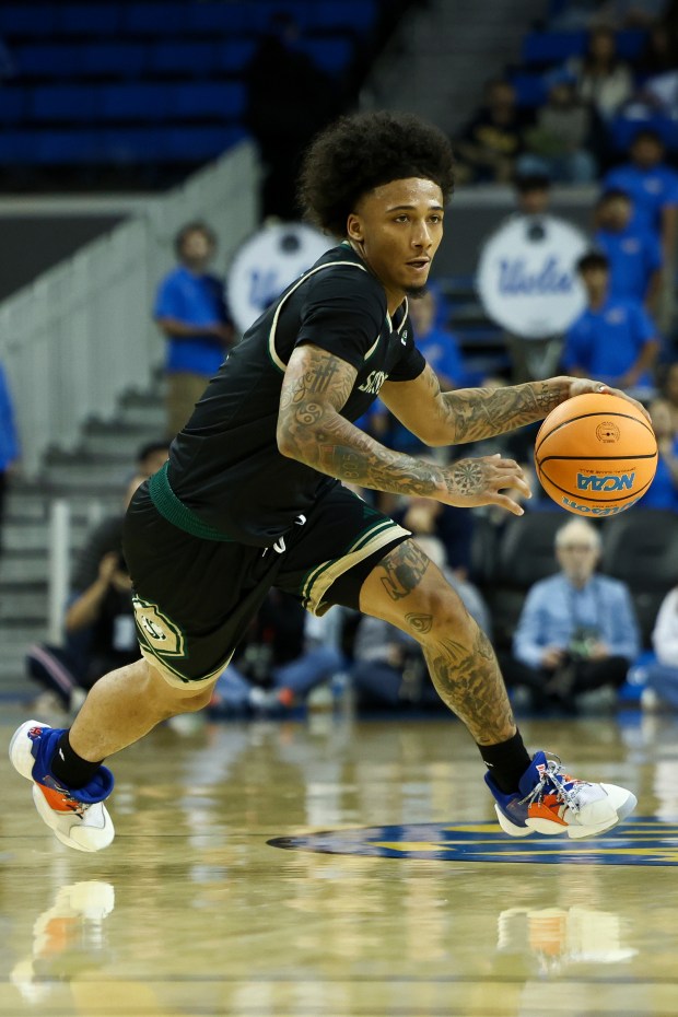 Sacramento State guard Mikey Williams dribbles the ball during the...