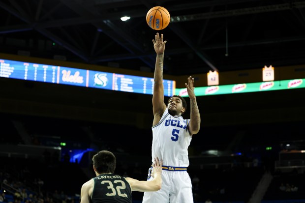 UCLA guard Brandon Williams (5) shoots against Sacramento State forward...