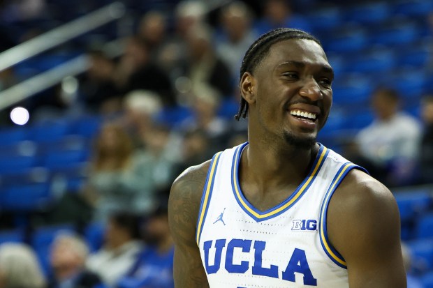 UCLA forward Eric Dailey Jr. (3) reacts from the bench...