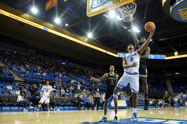 UCLA guard Eric Freeny (8) drives to the basket against...