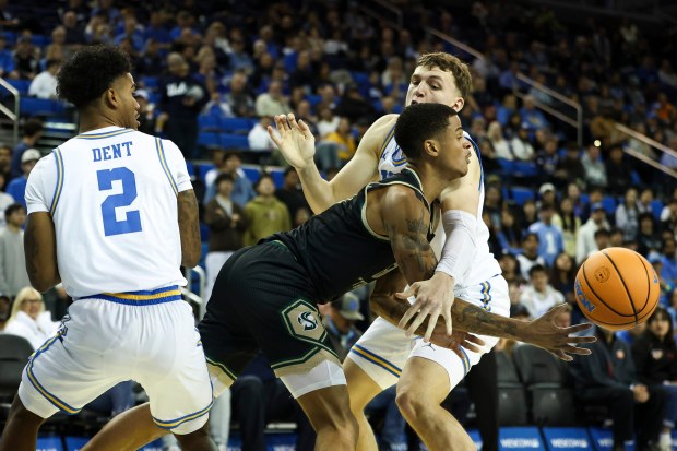 Sacramento State forward Shaqir O’Neal, center, passes the ball against...
