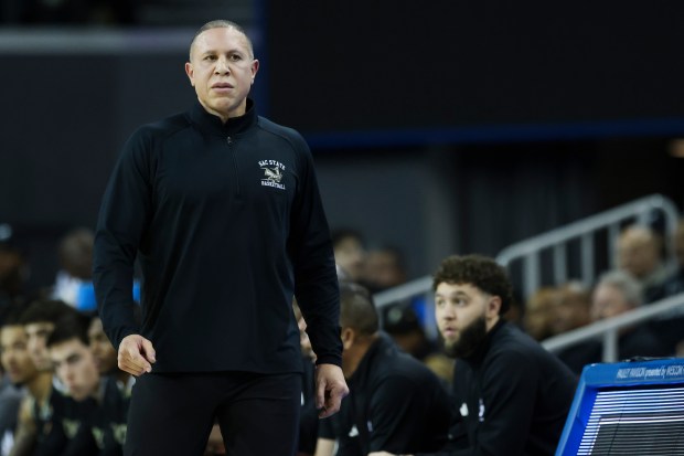 Sacramento State head coach Mike Bibby walks on the sidelines...