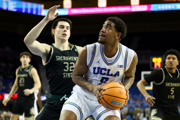 UCLA guard Brandon Williams (5) drives against Sacramento State forward...