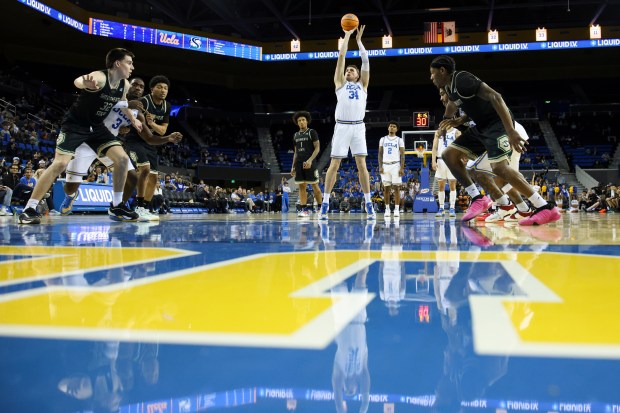 UCLA forward Tyler Bilodeau (34) shoots a free throw during...
