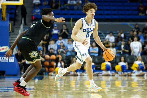 UCLA guard Trent Perry (0) dribbles against Sacramento State guard...