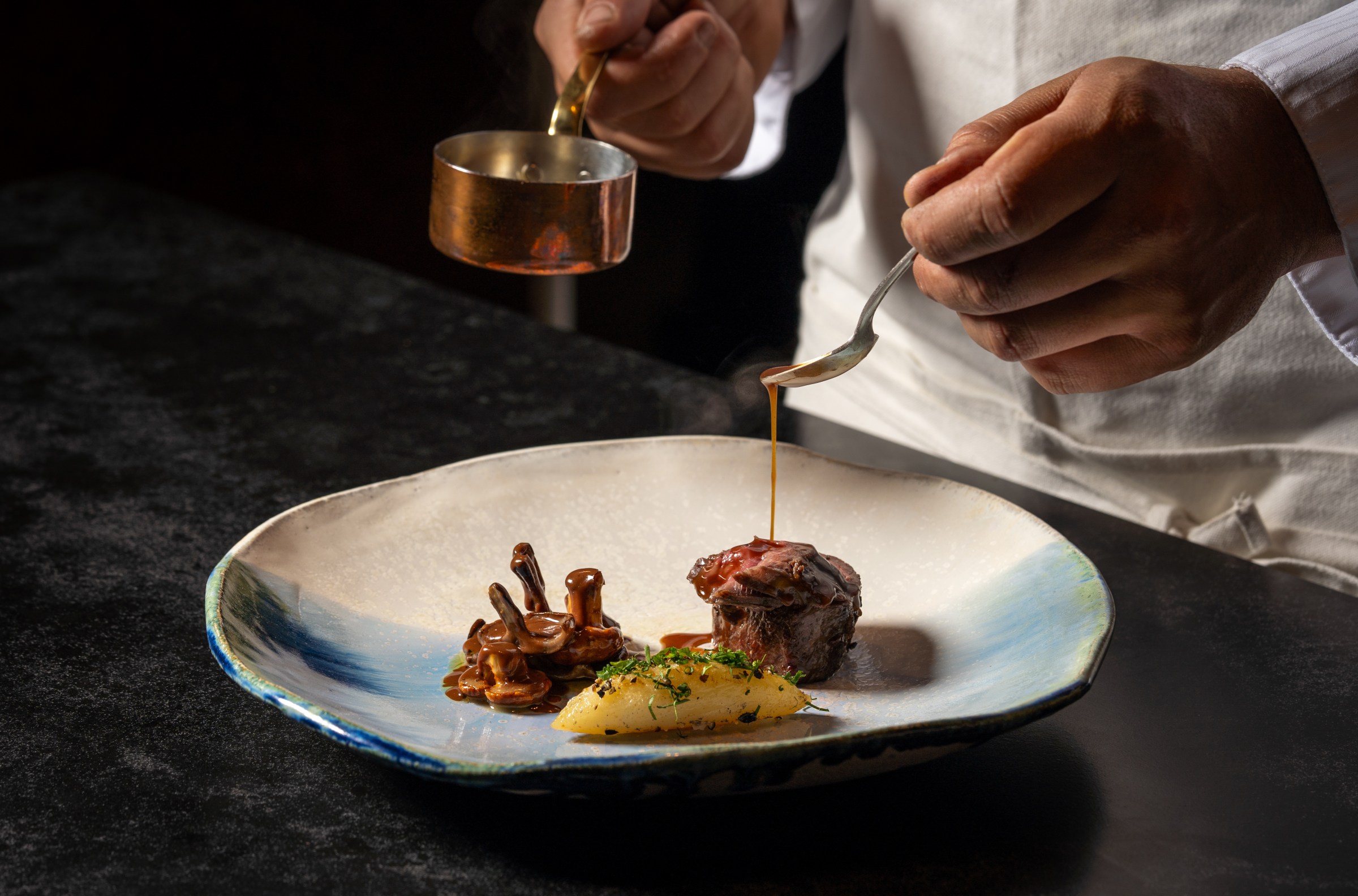 A beef dish being prepared at Lucien.