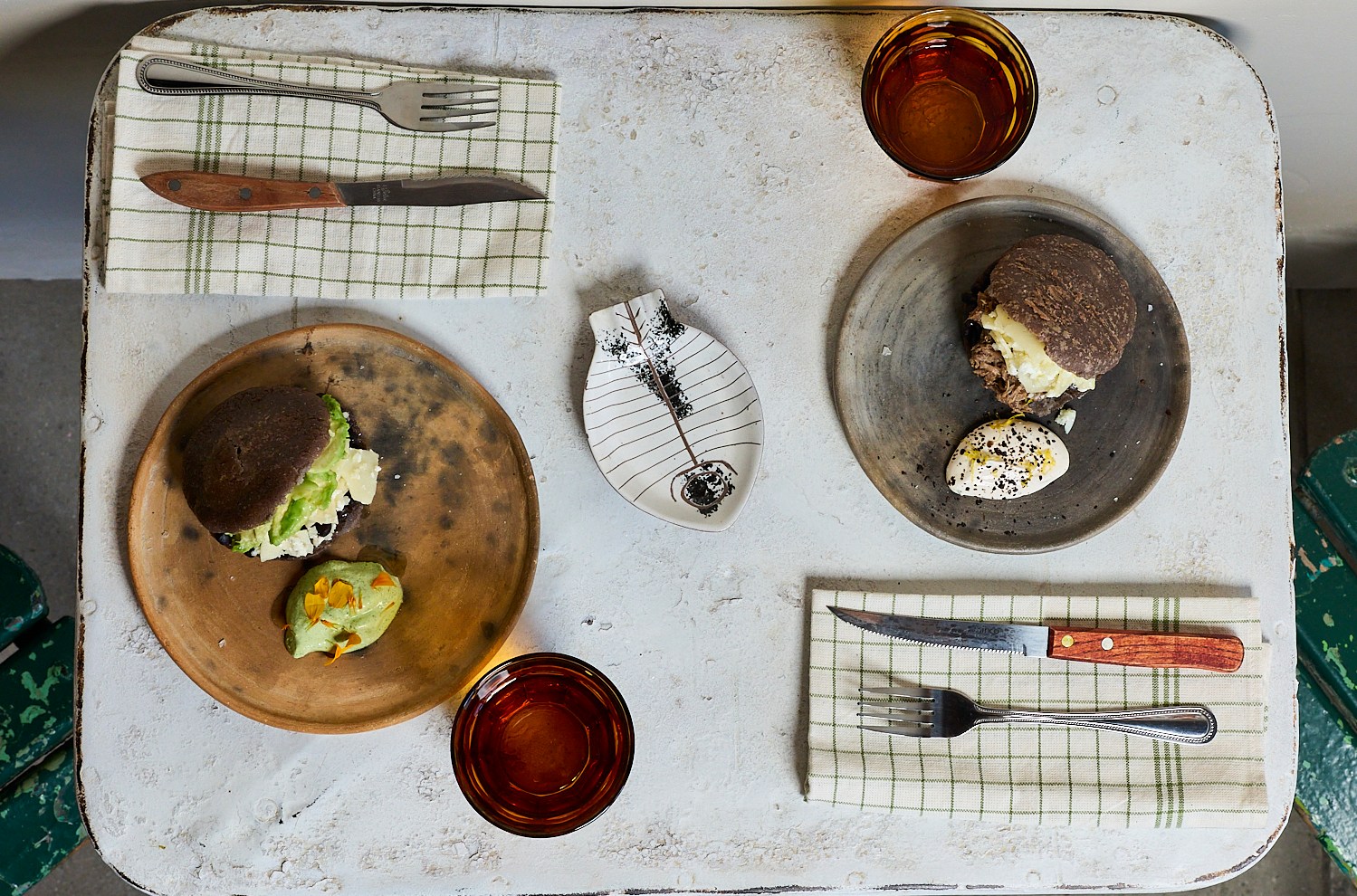 Overhead shot of two arepas on a white table at Chainsaw