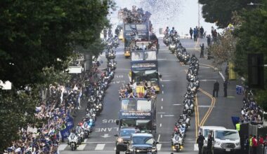 Los Angels Dodgers players and staff ride on a double-decker bus during a parade to celebrate the baseball team's World Series win on Monday, Nov. 3, 2025, in Los Angeles. (AP Photo/Jae C. Hong)