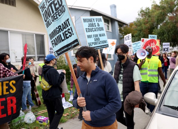 Community members take part in an U.S. Immigration and Customs...