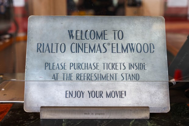 A sign is posted at the box office of Rialto...