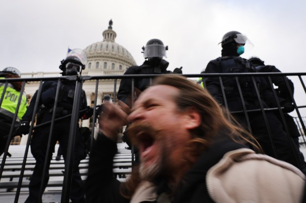 WASHINGTON, DC - JANUARY 06: Trump supporters gather outside the U.S. Capitol building following a "Stop the Steal" rally on January 06, 2021 in Washington, DC. A pro-Trump mob stormed the Capitol earlier, breaking windows and clashing with police officers. Trump supporters gathered in the nation's capital to protest the ratification of President-elect Joe Biden's Electoral College victory over President Donald Trump in the 2020 election. (Photo by Spencer Platt/Getty Images)