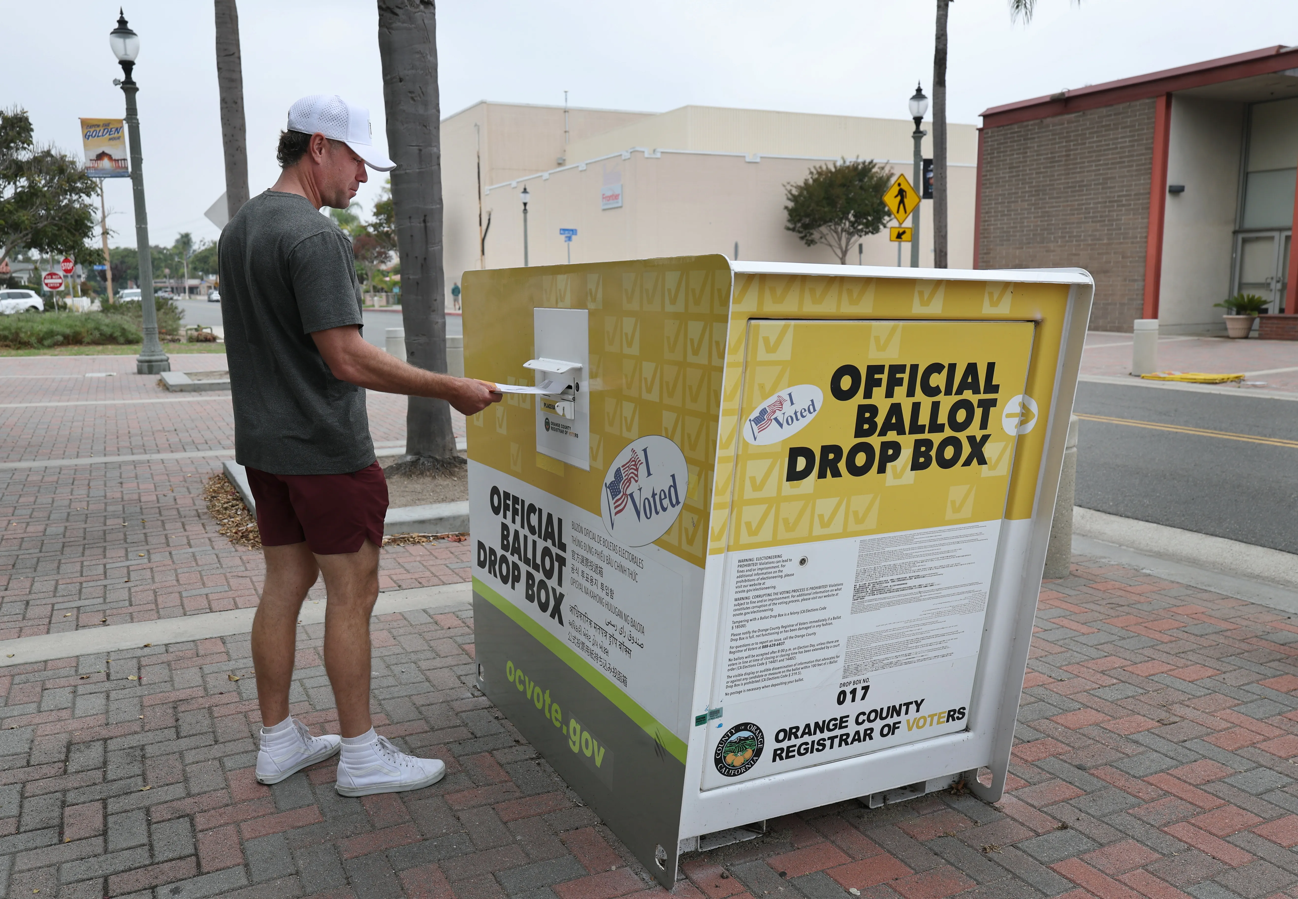 Huntington Beach, CA – October 25: Garrett Morgan, of Huntington Beach, puts his ballot in the official ballot drop box on Main Street in downtown Huntington Beach on the first day of early in-person and ballot drop-off voting, in the November 4, 2025 California Statewide Special Election at a drop-off box on Main Street in downtown Huntington Beach Saturday, Oct. 25, 2025.  As of October 25, 2025, vote centers in Los Angeles County are open for early in-person voting and ballot drop-off. (Allen J. Schaben / Los Angeles Times via Getty Images)