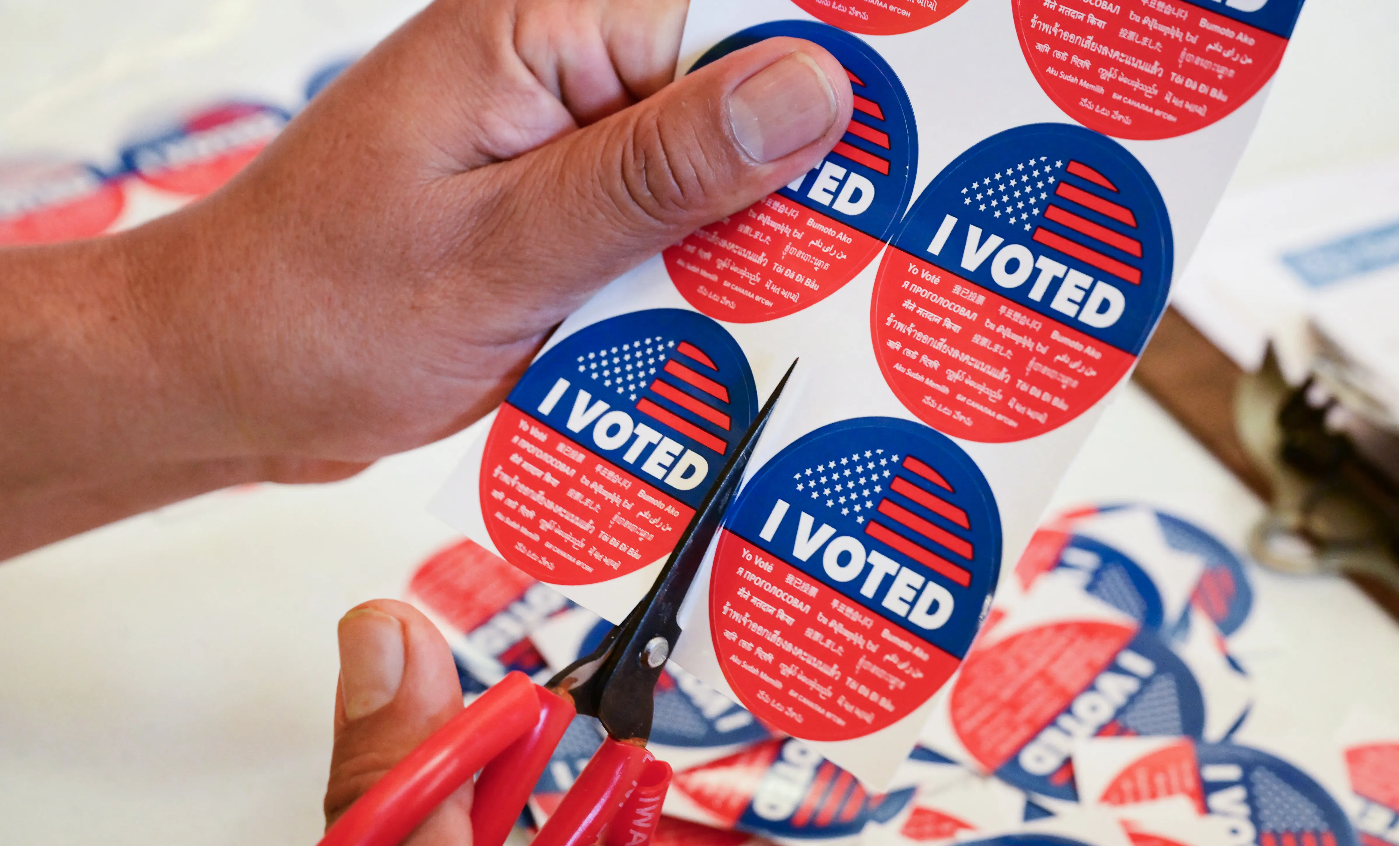 “I Voted” stickers are being prepared at a vote center in Los Angeles, on November 4, 2025, where where Proposition 50 is the only measure in the state’s special election. Californians were voting November 4 in a ballot measure likely to further tilt the liberal state towards the Democrats, as the party seeks to neutralize gerrymandering ordered by President Donald Trump. (Photo by Frederic J. BROWN / AFP) (Photo by FREDERIC J. BROWN/AFP via Getty Images)