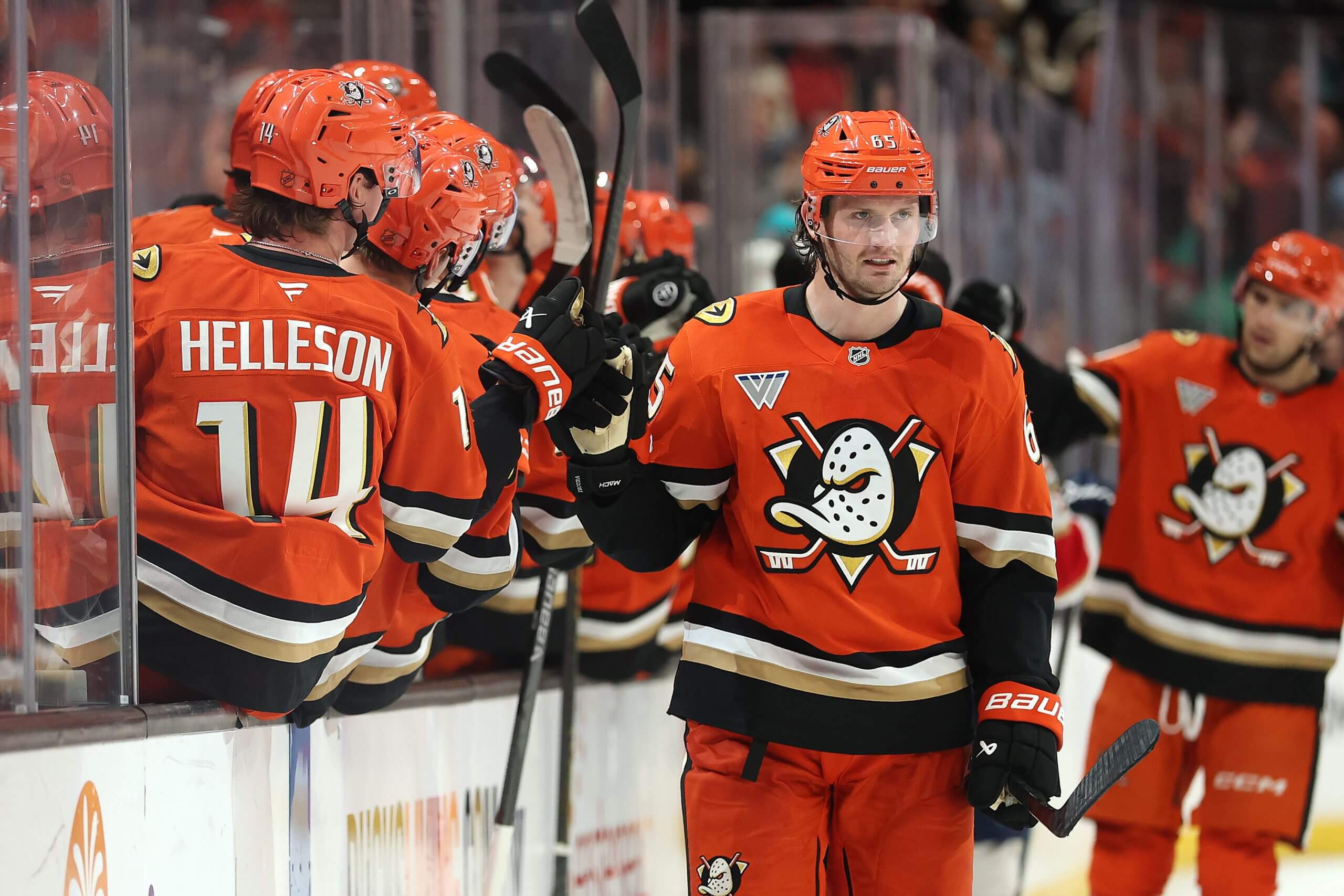 Jacob Trouba makes his way down the fist-bump line after scoring.