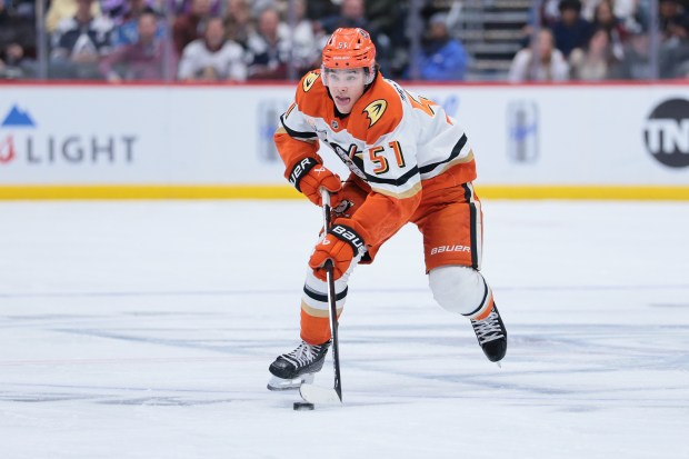 The Ducks’ Olen Zellweger skates with the puck during the...
