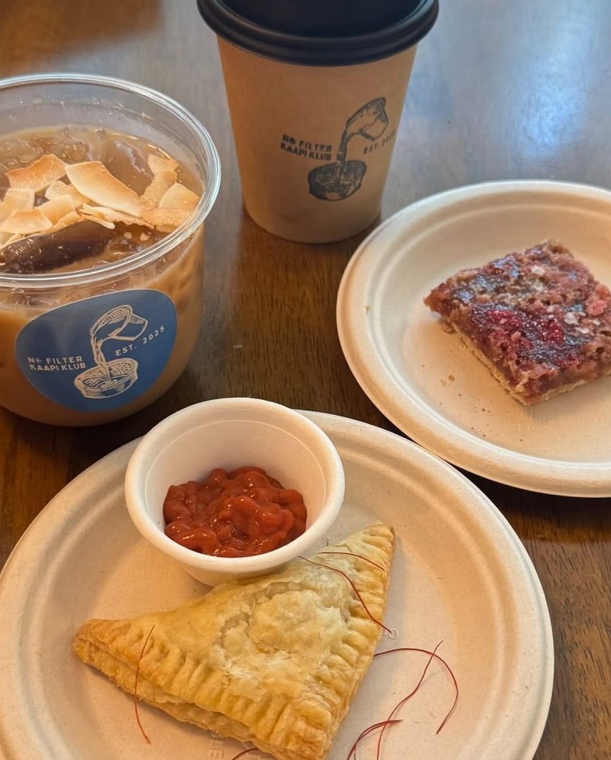 Pastries and coffees on a table.