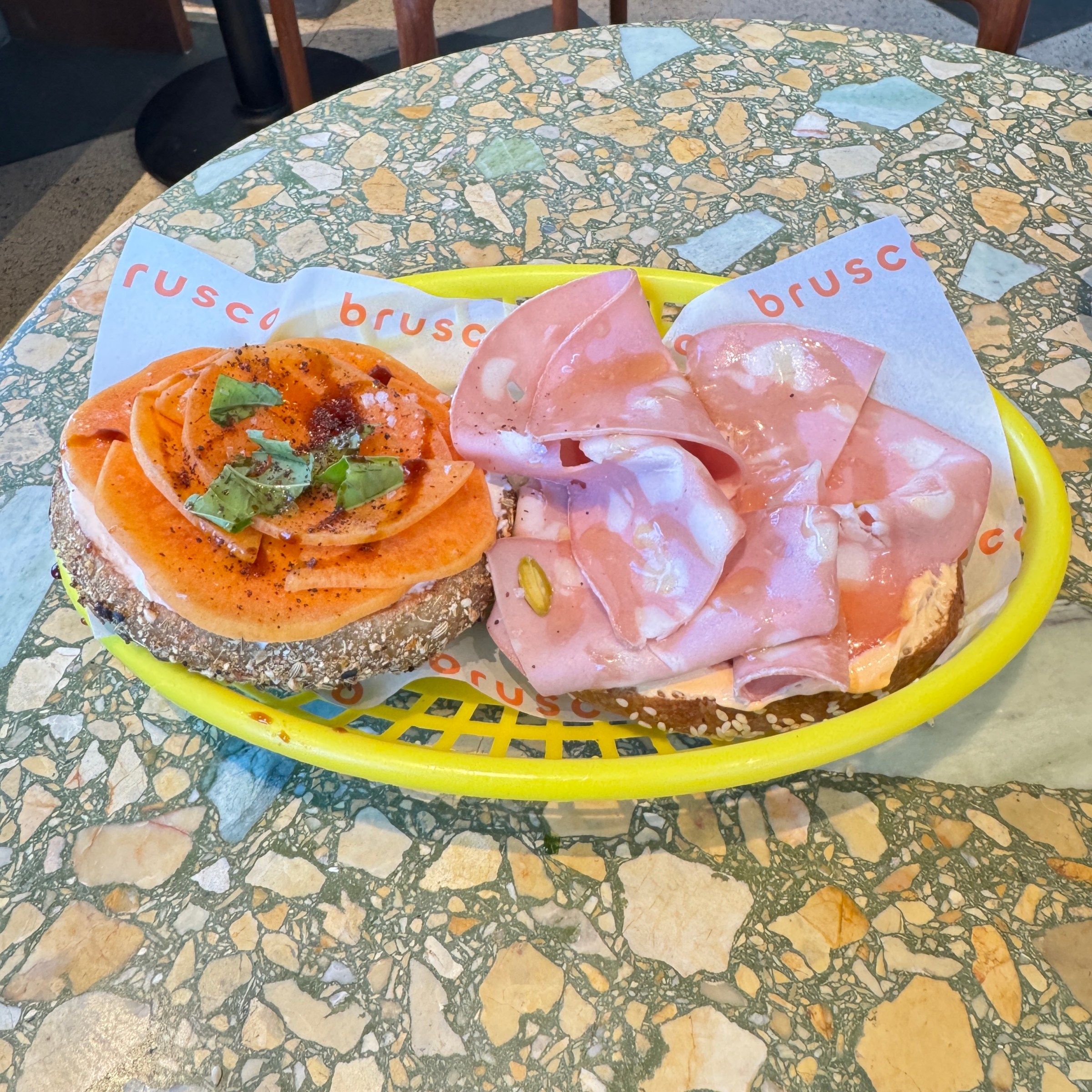 From left, the persimmon bagel and mortadella bagel at Cafe Brusco in Berkeley.