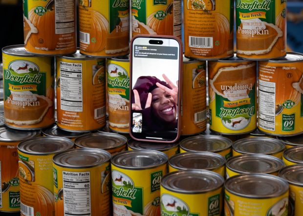 Volunteers Kyndall Williams, 14, and Tierra Jones, 17, facetime a...