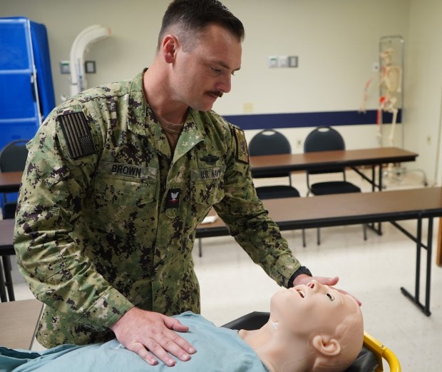Petty Officer 3rd Class Carl Brown of Yorba Linda serves...