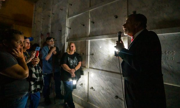 Fairhaven service director, Rich Landuyt, right, uses lantern light as...
