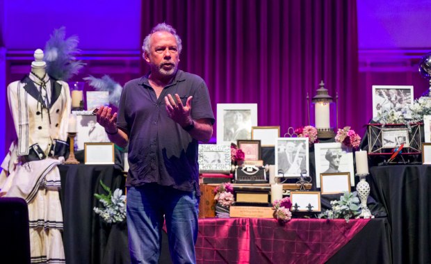 Author and historian, Chris Epting, center, speaks next to a...