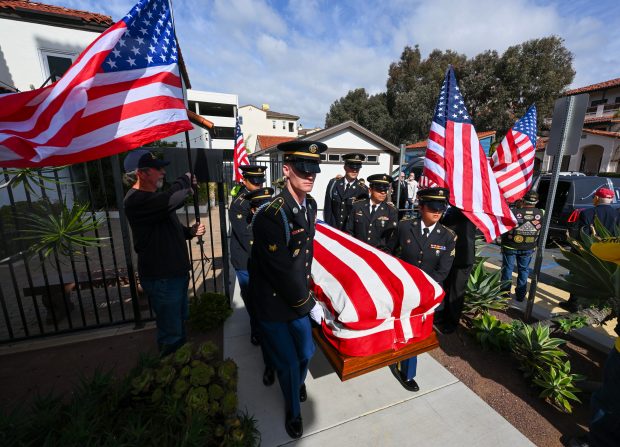 Paulbearers carry the casket of U.S. Army PFC Jake Chandler...