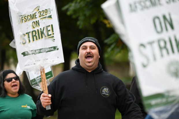 Israel Torres a cook at UC Riverside pickets through campus...
