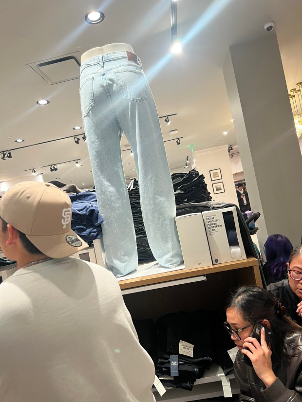 Shoppers take shelter inside the Abercrombie & Fitch store at...