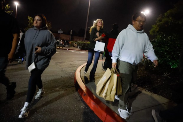 People leave Valley Fair as police investigate a shooting incident...