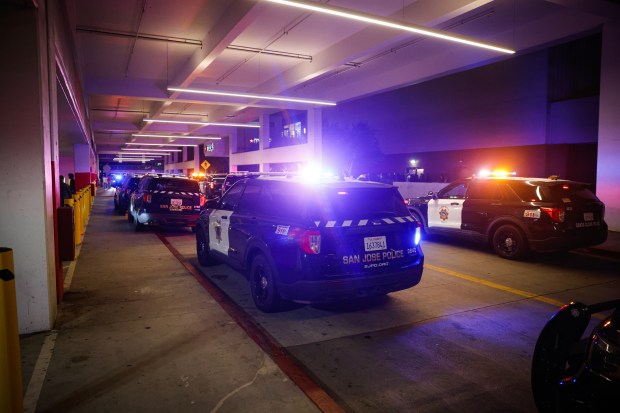 Police investigate a shooting incident at Valley Fair in San...