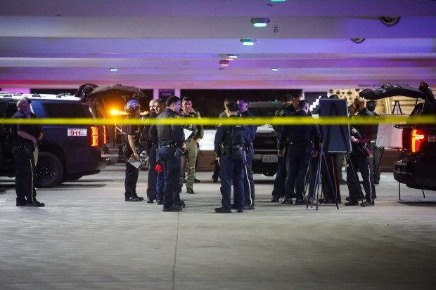 Police investigate a shooting incident at Valley Fair in San...