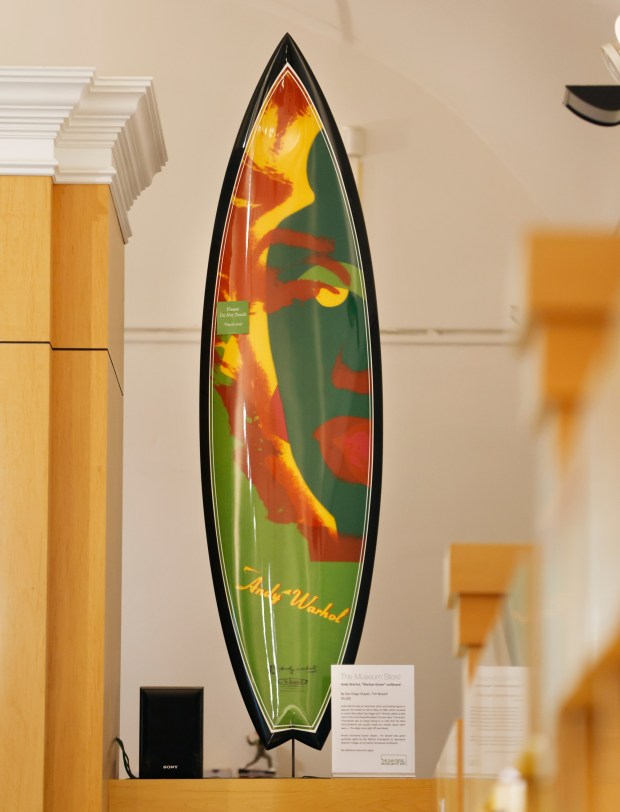 San Diego, CA - November 20: An Andy Warhol "Marilyn Green" surfboard by shaper Tim Bessell is displayed for sale at the Museum Store at the San Diego Museum of Art on November 20, 2025 in San Diego, CA. (K.C. Alfred / The San Diego Union-Tribune)