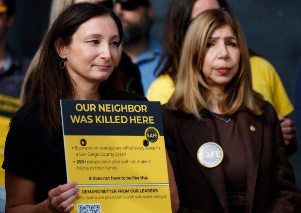 Laura Keenan, founder of Families for Safe Streets San Diego, and San Diego County District Attorney Summer Stephan listen during an event to observe World Day of Remembrance for Road Traffic Victims on Nov. 16, 2025 in San Diego, CA. Keenan's husband Matt was hit and killed by a wrong-way driver riding his bike in Mission Valley in 2021. (K.C. Alfred / The San Diego Union-Tribune)