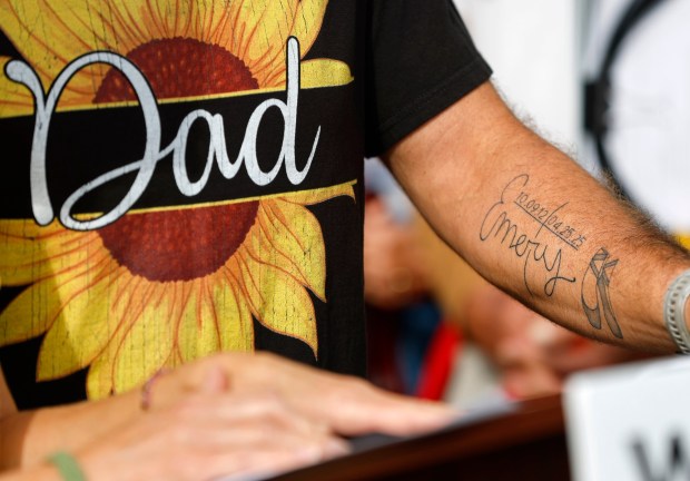 John Chalekian, who has a tattoo in honor of his daughter Emery, speaks at an event to observe World Day of Remembrance for Road Traffic Victims on Nov. 16, 2025 in San Diego, CA. HIs daughter, Emery Chalekian, 12, was killed while crossing Encinitas Boulevard in a marked crosswalk in April. (K.C. Alfred / The San Diego Union-Tribune)