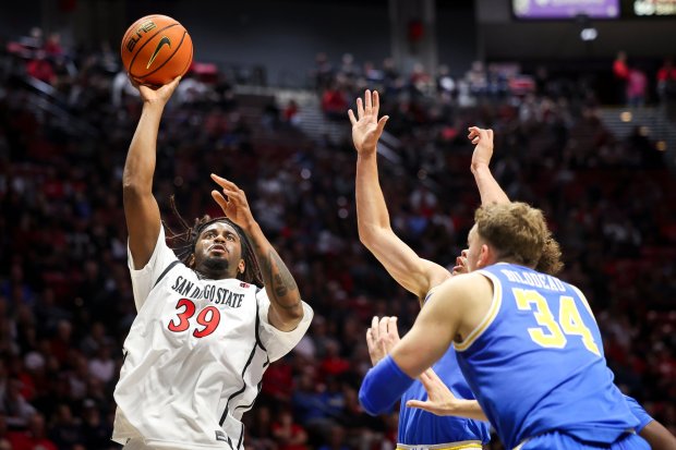 Reese Dixon-Waters #39 of San Diego State shoots against Trent Perry #0 of UCLA during an exhibition game at Viejas Arena on Friday, Oct. 17, 2025 in San Diego, California. (Meg McLaughlin / The San Diego Union-Tribune)