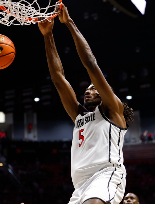 SDSU's Pharaoh Compton has one of his four dunks against Idaho State at Viejas Arena on Sunday. (K.C. Alfred / The San Diego Union-Tribune)