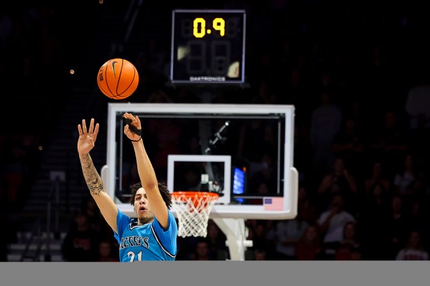 Miles Byrd #21 of San Diego State shoots a 3-pointer to send the game against Troy into overtime at Viejas Arena on Wednesday, Nov. 19, 2025 in San Diego, California. (Meg McLaughlin / The San Diego Union-Tribune)