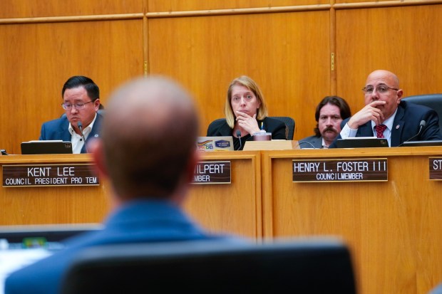 San Diego Councilmember Marni Von Wilpert questioned city parks department staff during the discussion of parking fees in Balboa Park at the San Diego City Council meeting on Tuesday, Nov. 18, 2025. Seated next to Von Wilpert are Councilmembers Kent Lee and Henry L. Foster III. (Nelvin C. Cepeda / The San Diego Union-Tribune)