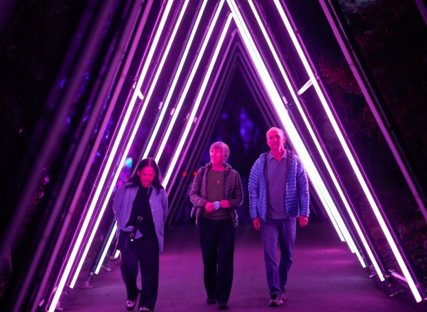 Maya Miller (l), Beth Hergesheimer (m) and Peter Hergesheimer were among some of the early guest enjoying the evening at the Lightscape at San Diego Botanic Garden on Thursday, Nov. 13, 2025 in Encinitas, CA. (Nelvin C. Cepeda / The San Diego Union-Tribune)