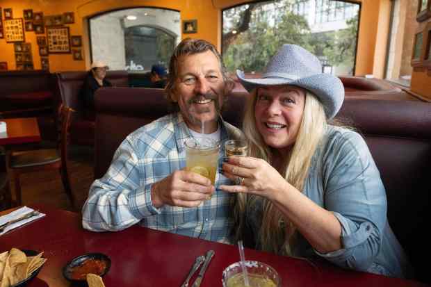 From left, Robert and Coral Netal enjoy themselves at the...
