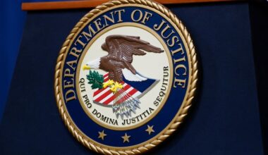 The seal of the U.S. Justice Department is seen on the podium in the Department's headquarters briefing room before a news conference with the Attorney General in Washington, January 24, 2023. (Reuters File)