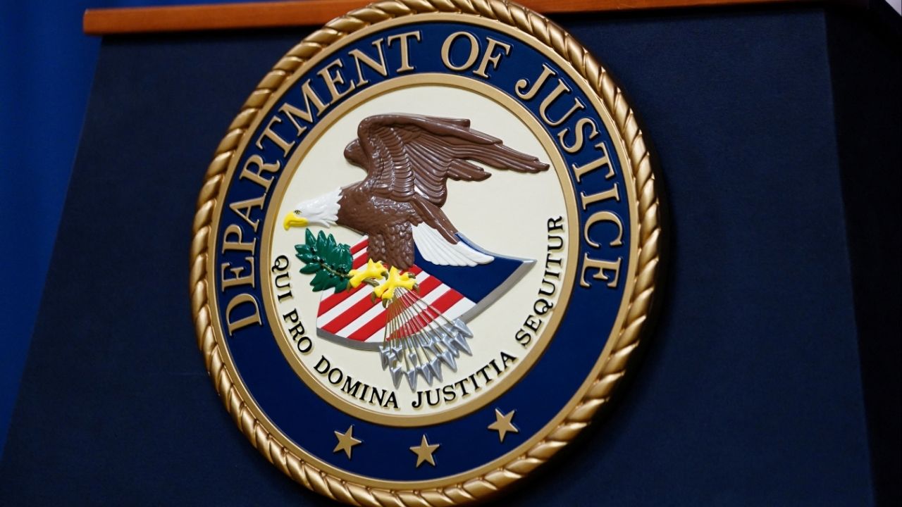 The seal of the U.S. Justice Department is seen on the podium in the Department's headquarters briefing room before a news conference with the Attorney General in Washington, January 24, 2023. (Reuters File)