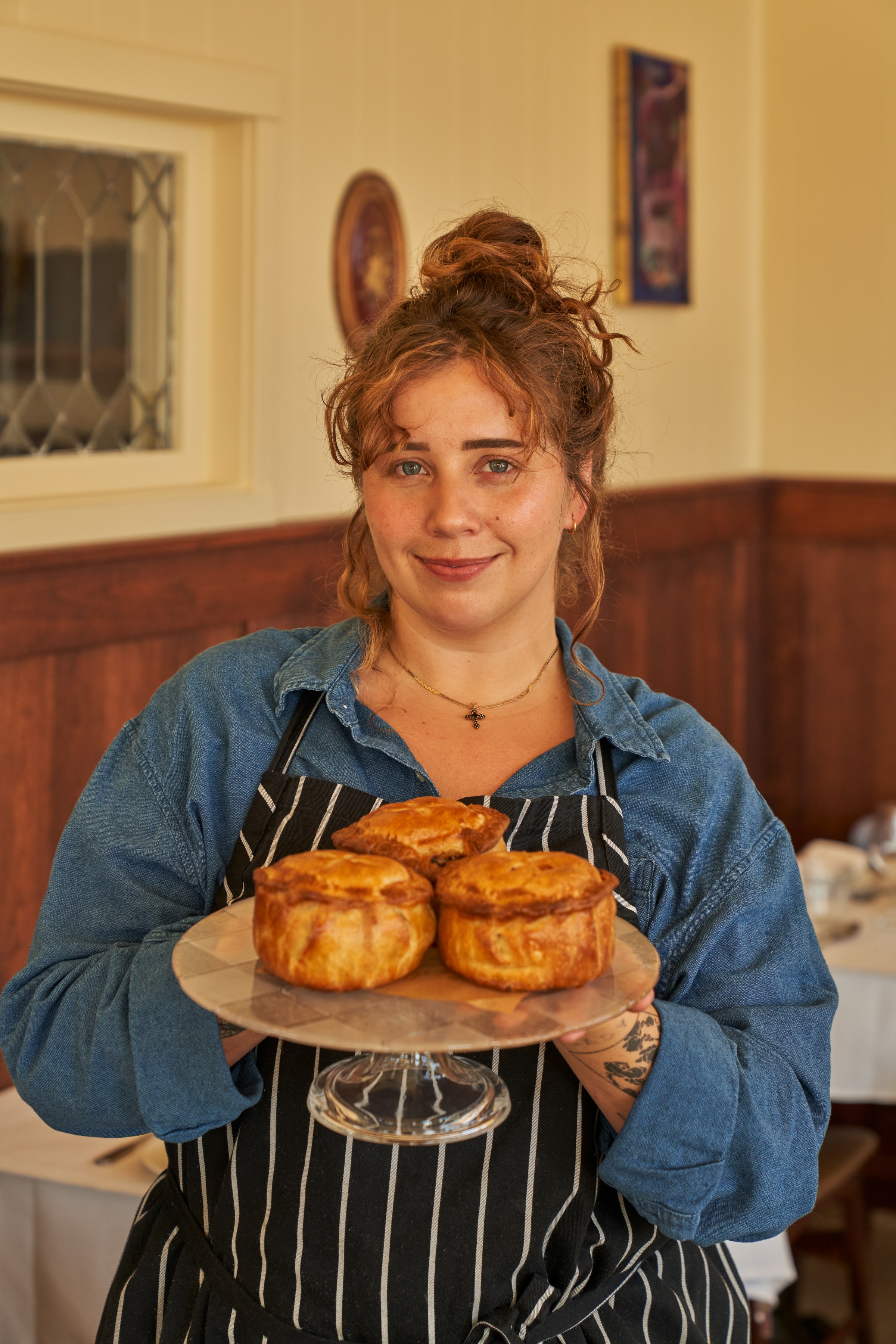 Sarah Durning holding a plate of pastries at Wilde’s