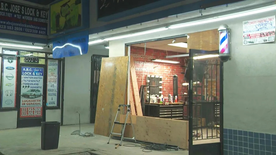 The storefront of LA Fresh Cuts was destroyed after the burglars rammed their truck into the glass doors and windows. (KTLA)