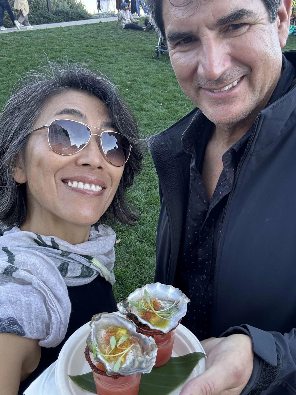 Yoshiko Sato snaps a selfie with husband Richard Kreis and their oyster shots. (Courtesy of Yoshiko Sato)