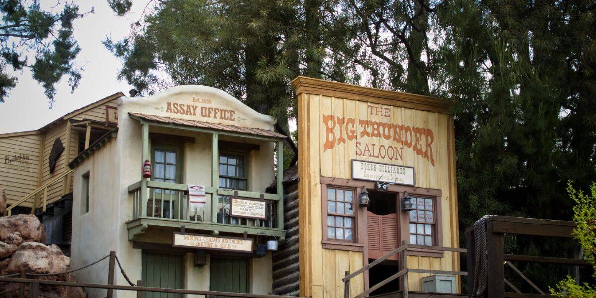 Old Western-style buildings in Rainbow Ridge on Big Thunder Mountain Railroad at Disneyland.