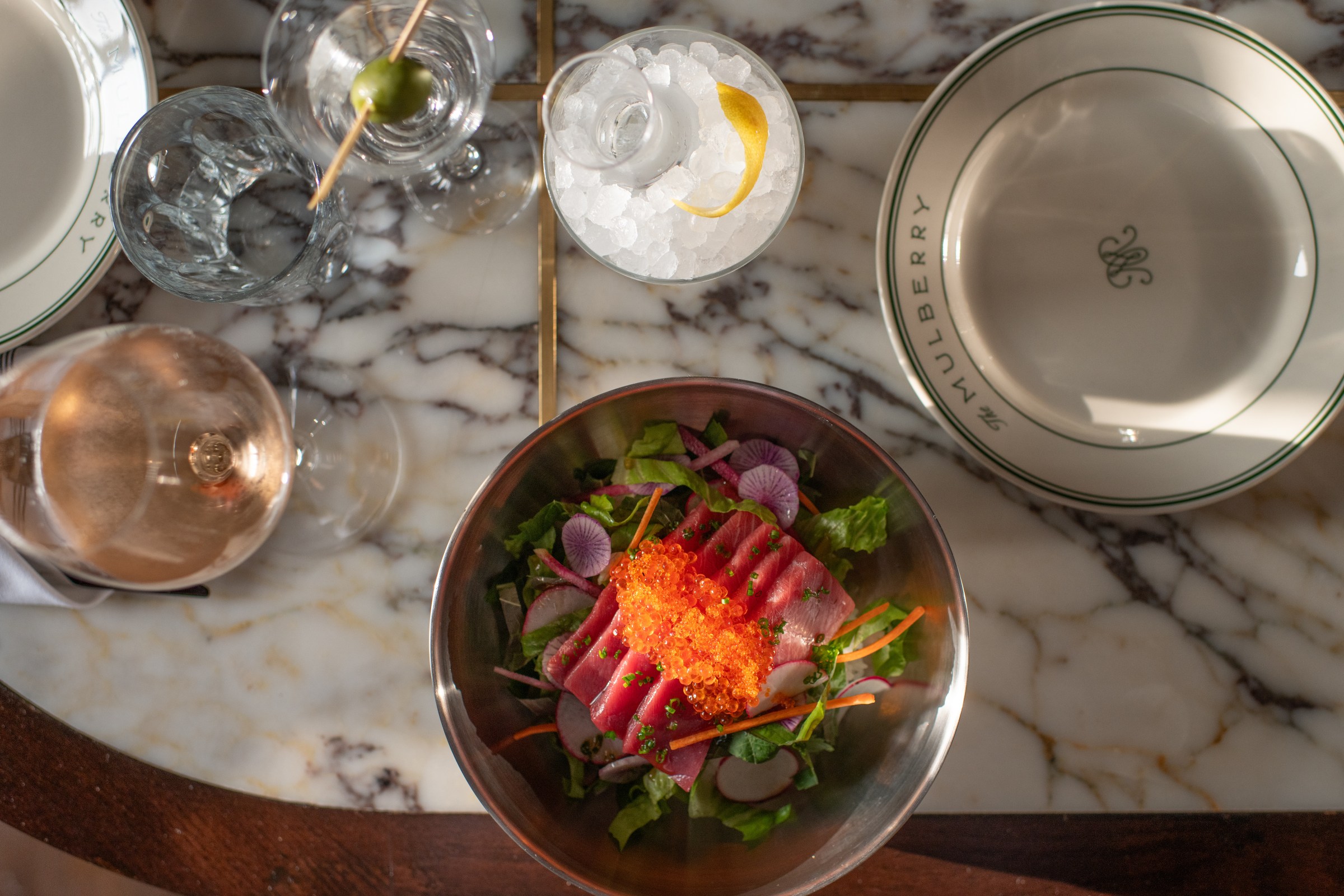 Bluefin tuna and trout roe over crisp vegetables and rice.