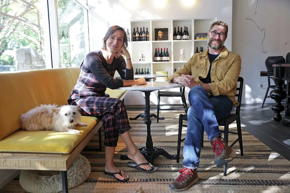 Marietta Cellars owners Lisa Steinkamp and Scot Bilbro with their dog, Harry, at their new tasting room. (Scott Strazzante/S.F. Chronicle)