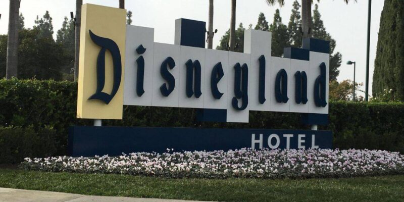 A large sign reads "Disneyland Hotel" in decorative lettering.